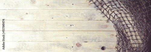 Fishing nets on wooden background. Still-life and objects. photo