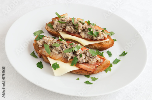 cep caviar on toast with cheese and bacon
