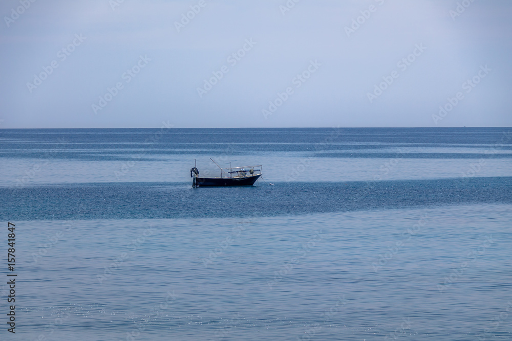 A boat in a Mediterranean beach of Ionian Sea - Bova Marina, Calabria, Italy
