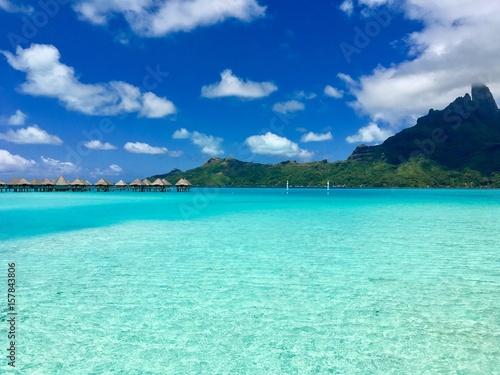 Overwater bungalows of a luxury resort in the turquoise lagoon of Bora Bora  Tahiti  French Polynesia