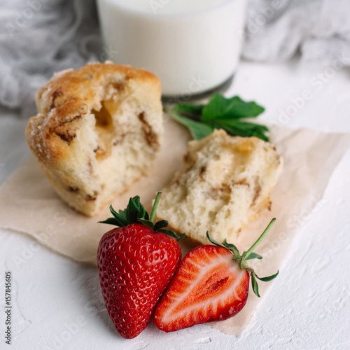 Muffin with milk and strawberries