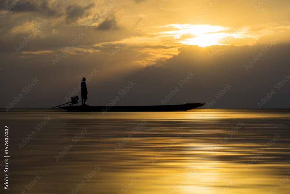 Silhouettes of fisherman at the lake with sunset, Thailand. Silhouettes of fisherman at the lake with sunset, Thailand.
