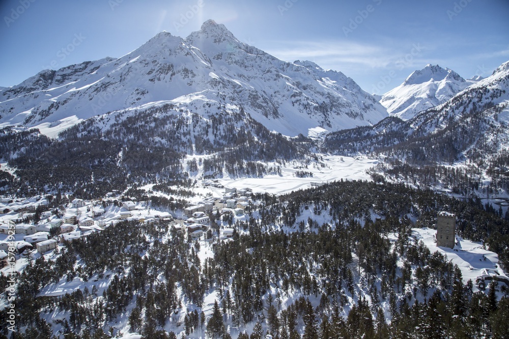 Aerial view of Belvedere tower with the houses of Maloja Pass covered in snow. Maloja Pass, Engadine, Canton of Grisons Switzerland Europe