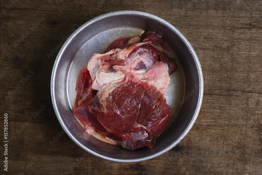 Fresh Red Meat Inside Aluminium Food Container With Dramatic Lighting Set Up Over Wooden Backgrounds