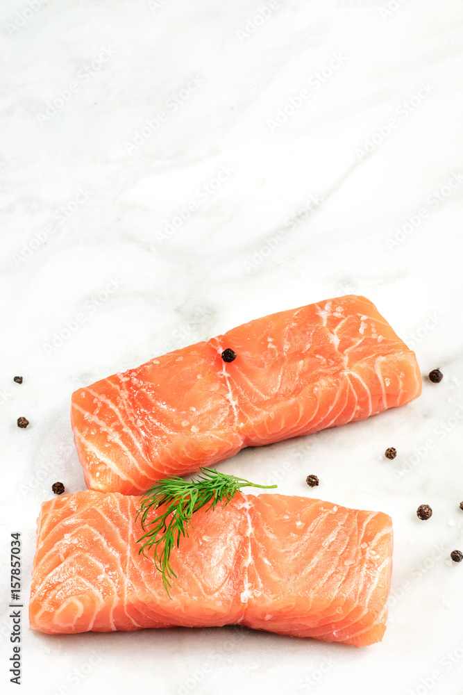 Slices of salmon with dill, peppercorns, and copyspace Slices of salmon with dill, peppercorns, and copyspace