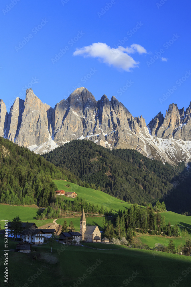 The village of St. Magdalene surrounded by green meadows at the foot of the Odle Funes Valley South Tyrol Dolomites Italy Europe