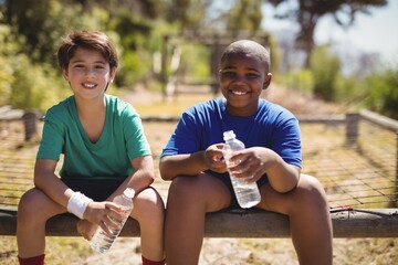 Portrait of smiling friends relaxing after workout 