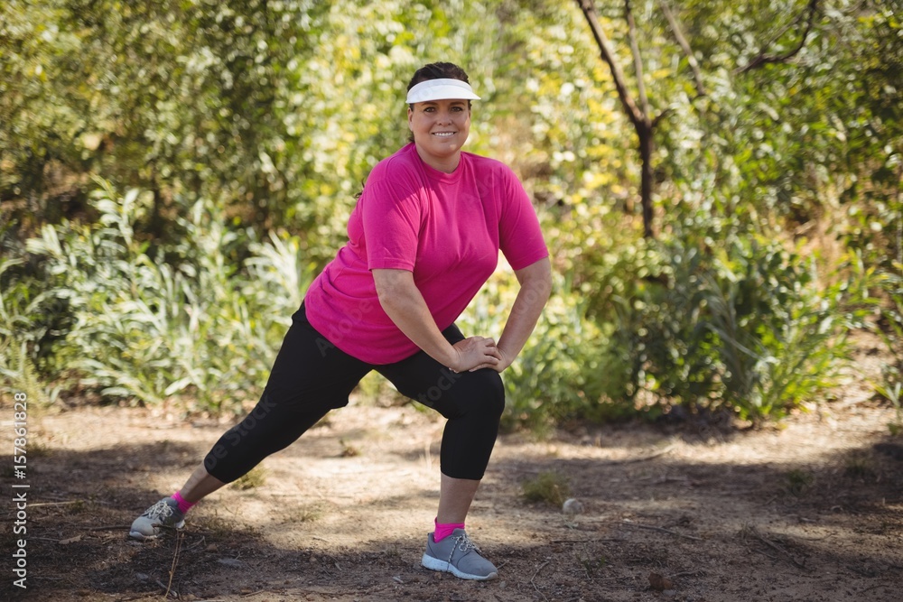 Portrait of happy woman exercising during obstacle course Portrait of happy woman exercising during obstacle course