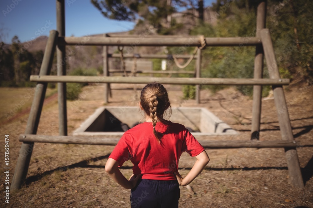 Rear view of girl looking at outdoor equipment Rear view of girl looking at outdoor equipment