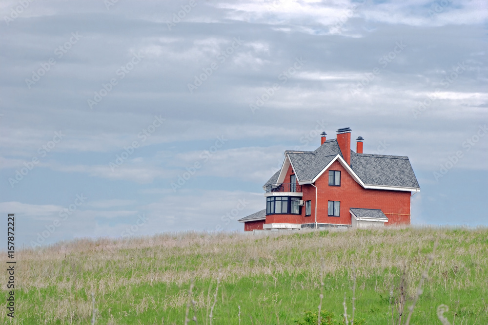 house on a background of blue sky with clouds house on a background of blue sky with clouds