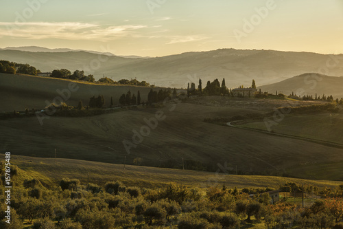 Montichiello - Tuscany/Italy: October 29, 2017: Winding Cypress lined road in Monticchiello, Val d'Orcia Tuscany Italy at sunset