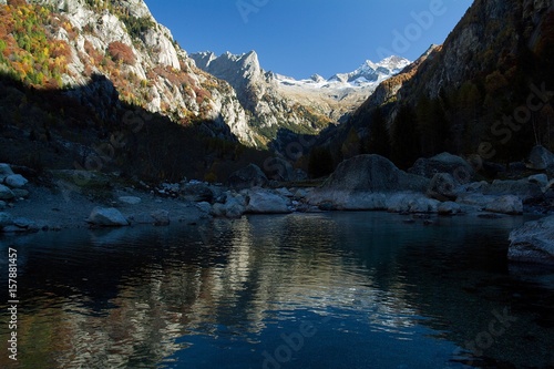 Peaks of Mount Disgrazia and peak of Pioda are reflected in a pool created by a landslide in Mello Valley. Valmasino. Valtellina. Lombardy Italy Europe photo