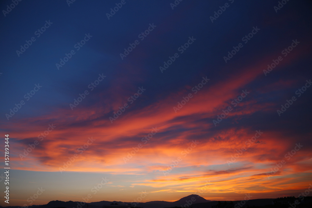 Sunset. Sky clouds background. Ridge Mountains silhouette. Skyline. Montenegro