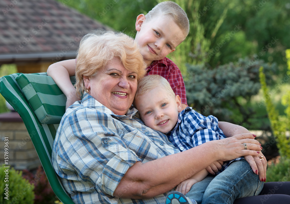 Family portrait.Beautiful grandma and her two beloved grandchildren. Family portrait.Beautiful grandma and her two beloved grandchildren.