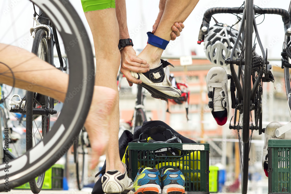 Naklejka premium triathlon competitors in cycling , cyclist in action and motion