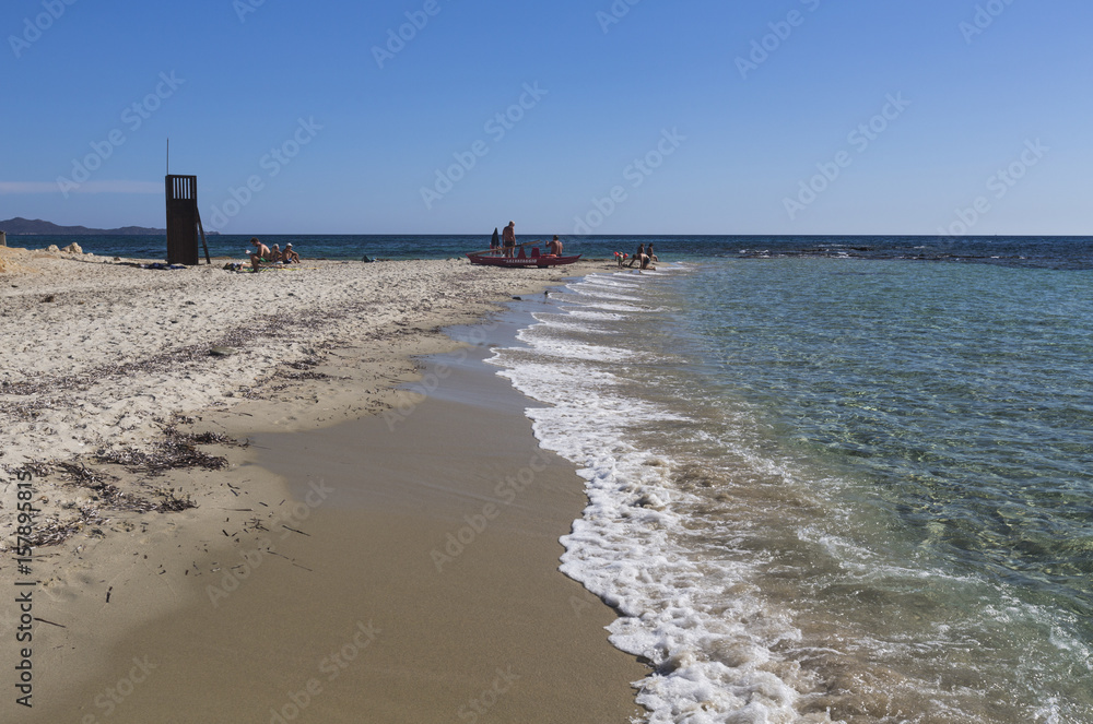 Lifeguard on the sandy beach surrounded by turquoise water of sea Sant Elmo Castiadas Costa Rei Cagliari Sardinia Italy Europe
