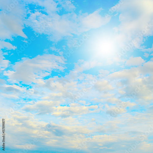 Fototapeta Naklejka Na Ścianę i Meble -  Sun in blue sky and beautiful white clouds.