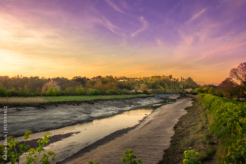 River Rother under the sunset at low tide, East Sussex, England