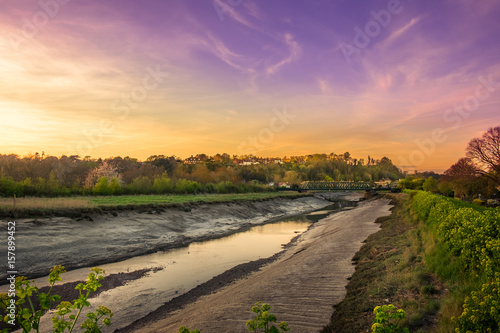 River Rother under the sunset at low tide, East Sussex, England