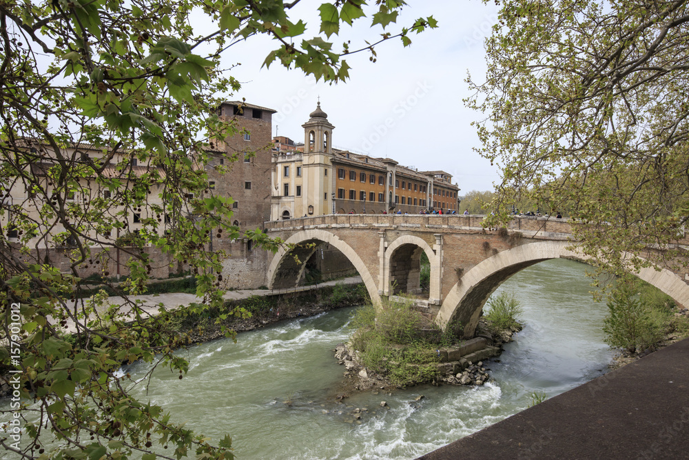 View of Lungotevere boulevard running along the river Tiber with typical bridges and buildings Rome Lazio Italy Europe