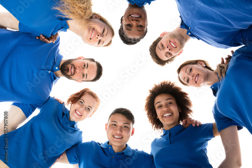 Happy Multiracial Janitors Forming Huddle