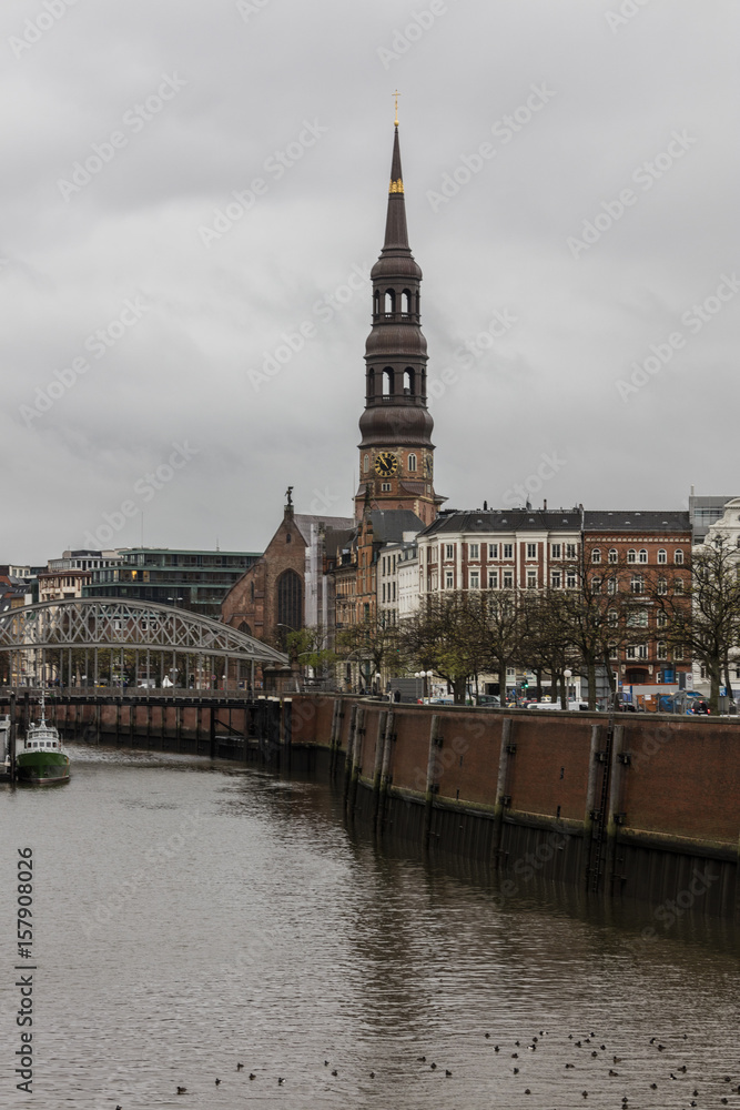 A view to the bell tower and the bridge on the canal Hamburg Germany Europe