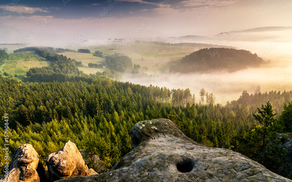 Morning hazy landscape under Cross Hill, Adrspach - Teplice rocks, Czech republic, Europe.