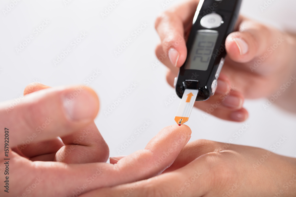 Finger Prick For Glucose Sugar Measuring Level Blood Test Stock Photo