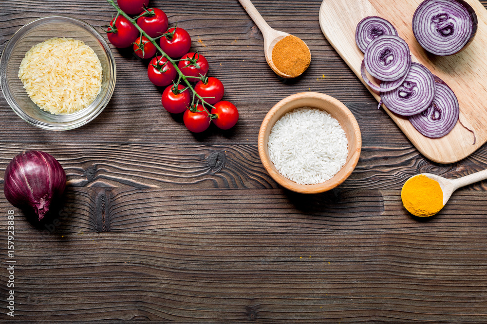 paella ingredients with rice, salt, spices and tomatoes on wooden table background top view mockup paella ingredients with rice, salt, spices and tomatoes on wooden table background top view mockup