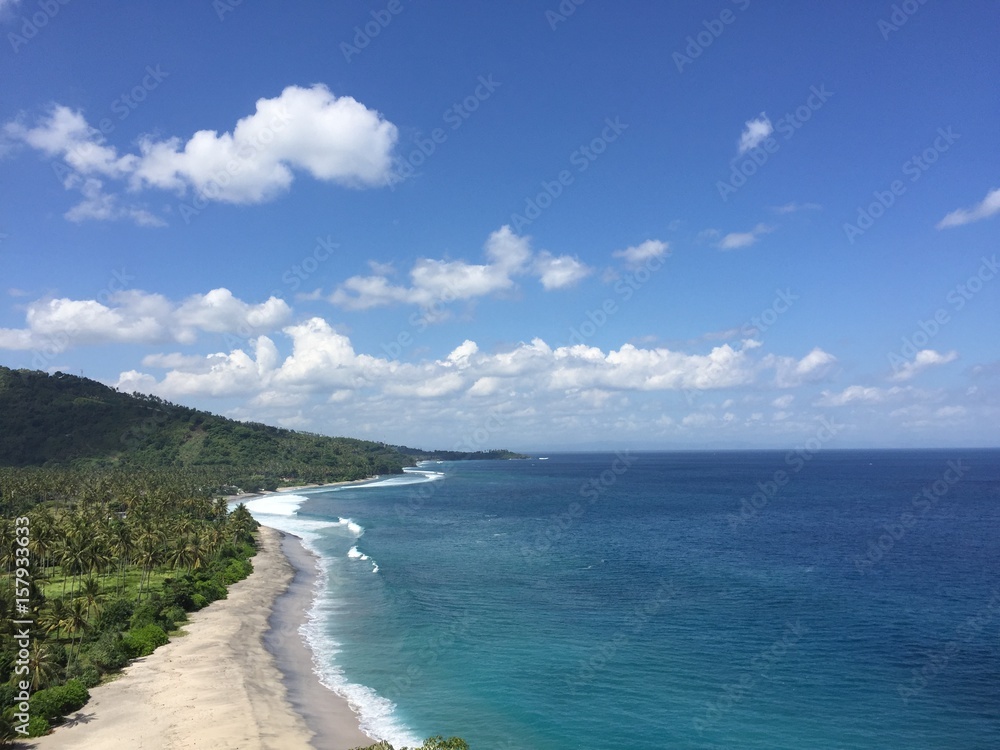 Beautiful blue beach on the coast of Senggigi, Lombok, Indonesia