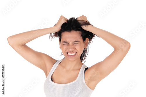 Angry woman messing her hair.