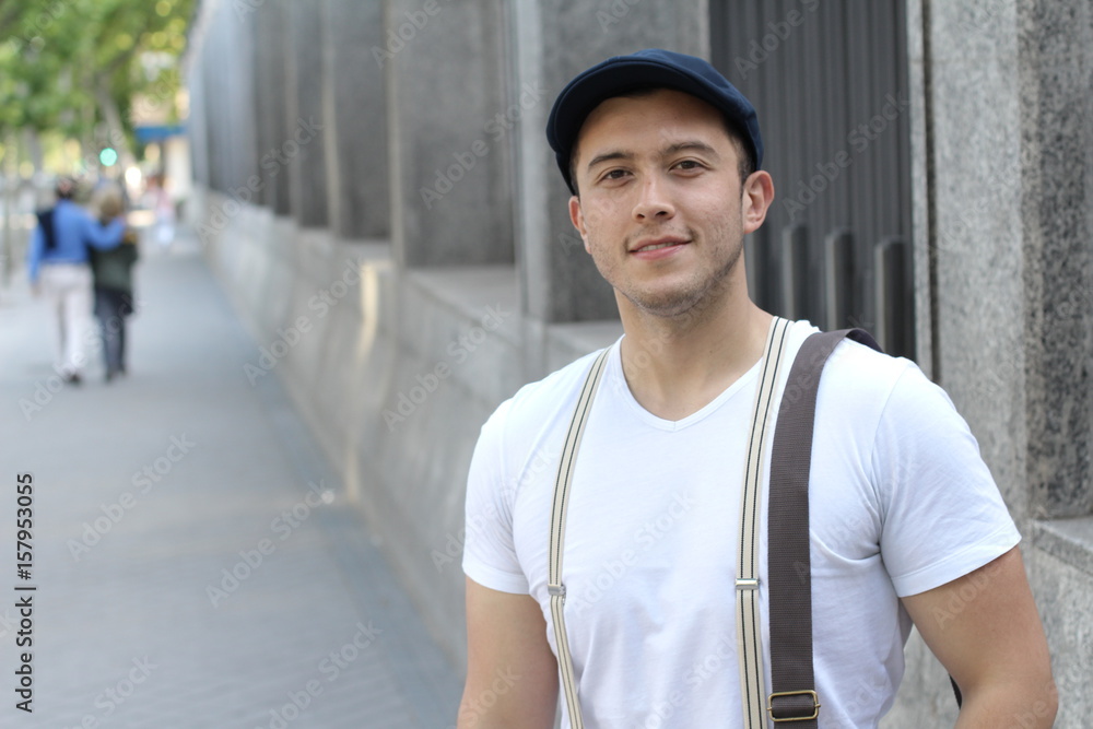 Mixed ethnicity student smiling on campus with copy space Mixed ethnicity student smiling on campus with copy space