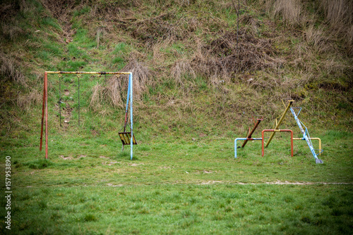 Foto Empty playground with swing and teeter