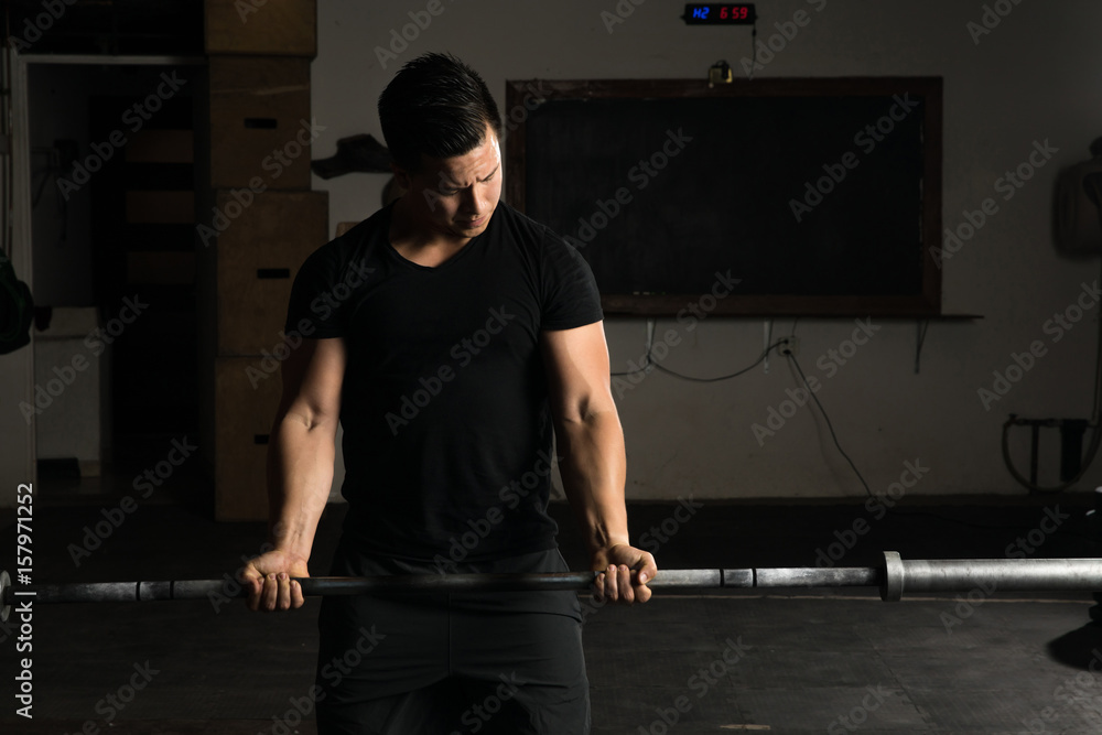 Man working out with a barbell Man working out with a barbell