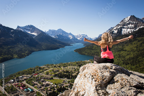 Girl looking from the view of Bear's Hump in Waterton National Park, Alberta