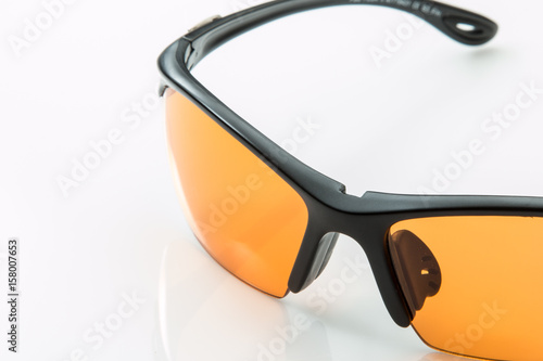 Eyeglasses for protection with orange yellow lenses.