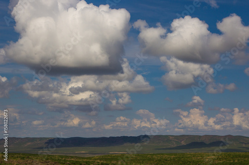 Steppe in spring  Kazakhstan. Amazing clouds and sky