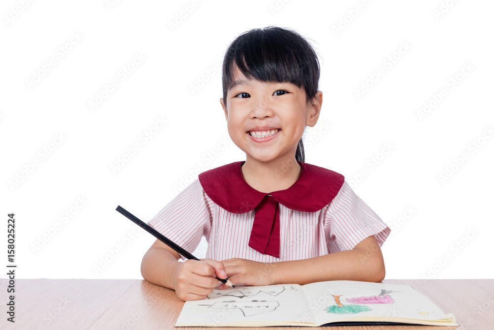 Asian Little Chinese girl drawing with color pencils Asian Little Chinese girl drawing with color pencils