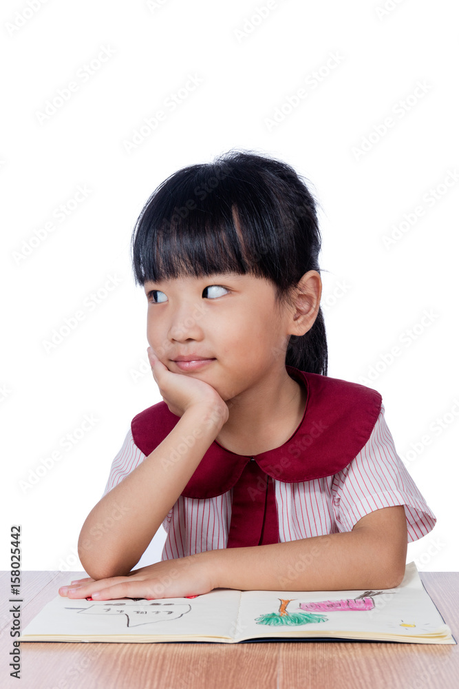 Asian Little Chinese girl reading a painting book Asian Little Chinese girl reading a painting book