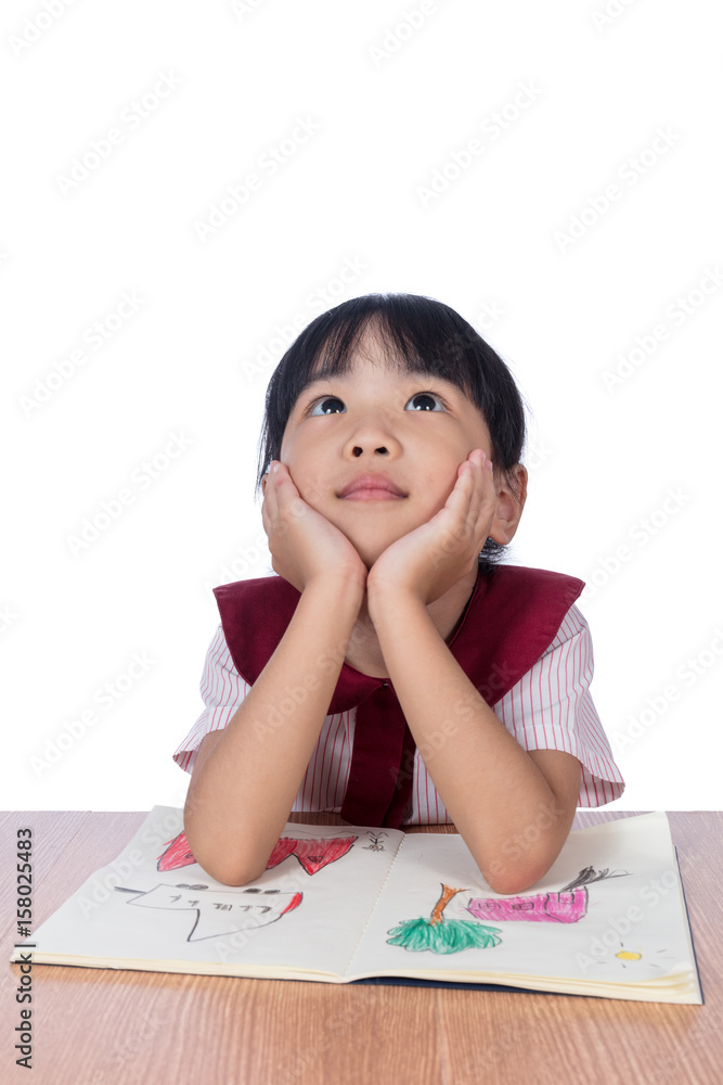 Asian Little Chinese girl reading a painting book Asian Little Chinese girl reading a painting book