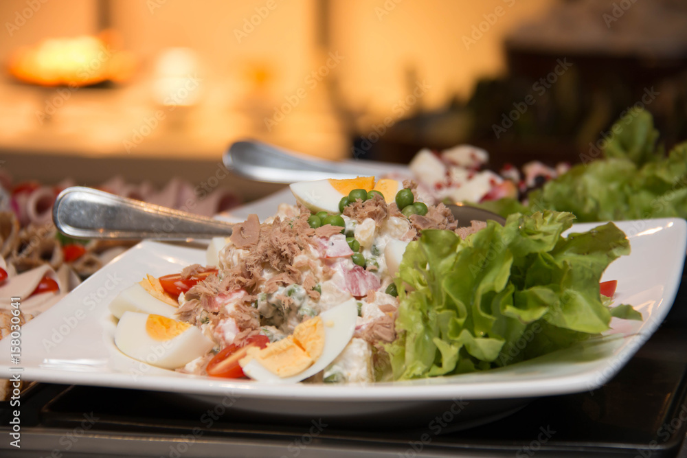 salads on a buffet table salads on a buffet table