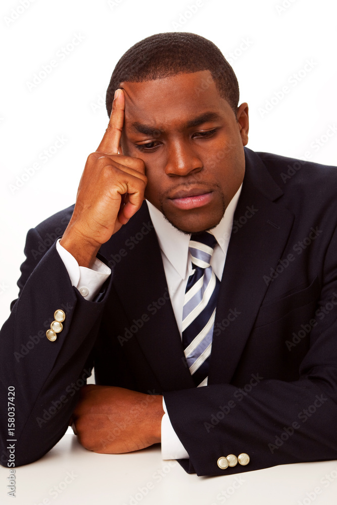 African American businessman in deep thought. African American businessman in deep thought.