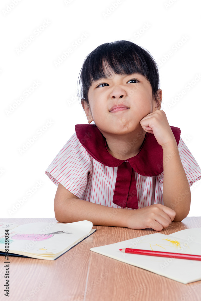 Asian Little Chinese girl drawing with color pencils Asian Little Chinese girl drawing with color pencils