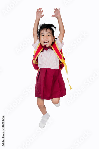 Asian Little Chinese girl in school uniform with school bag
