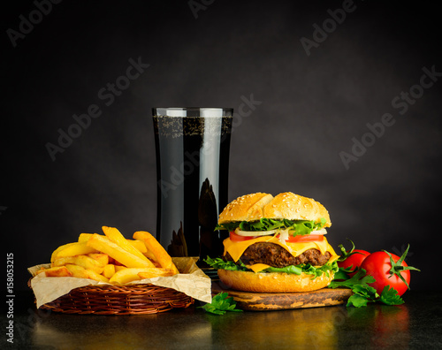 Canvas Print Tasty Looking Cheeseburger with Cola and French Fries