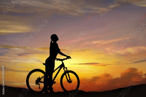 Fototapeta Naklejka Na Ścianę i Meble -  Crescent moon with beautiful sunset background . Dawn cloud .  Sunset or sunrise with clouds, light rays and other atmospheric effect . Silhouette of the young sports girl