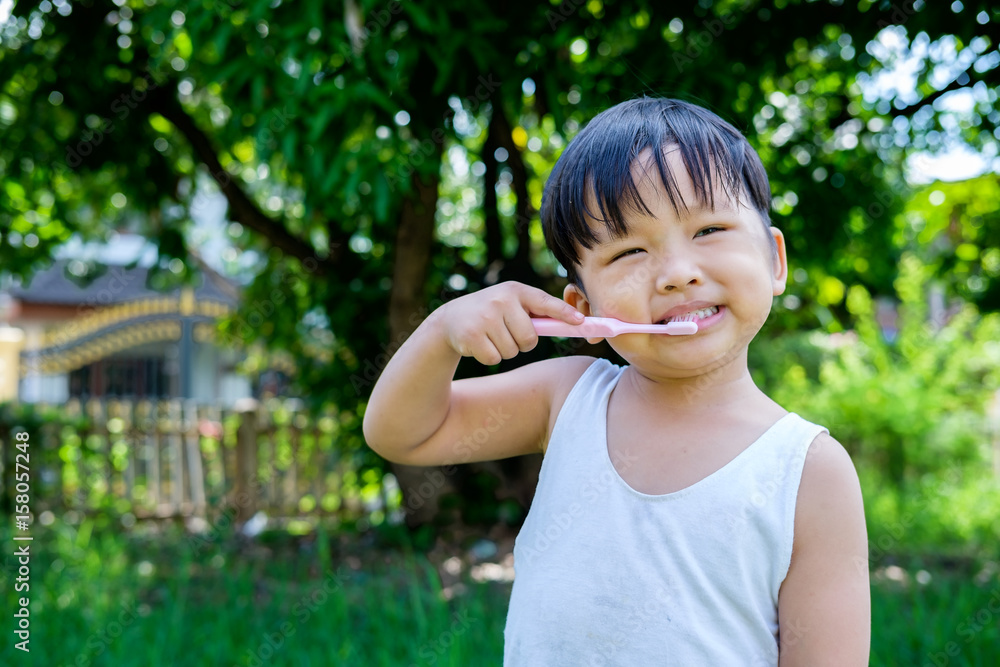 Little beautiful asian boy brushing teeth, healthy concept.Close up Little beautiful asian boy brushing teeth, healthy concept.Close up
