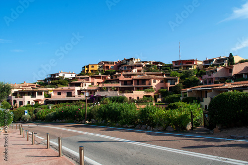 Fototapeta Naklejka Na Ścianę i Meble -  Main street with colorful luxury houses in Porto Cervo (Sardinia, Italy)