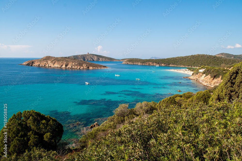 Tuerredda Beach, Sardinia - Clear turquoise clear sea, islands and rocks on the coast. Tuerredda Beach, Sardinia - Clear turquoise clear sea, islands and rocks on the coast.