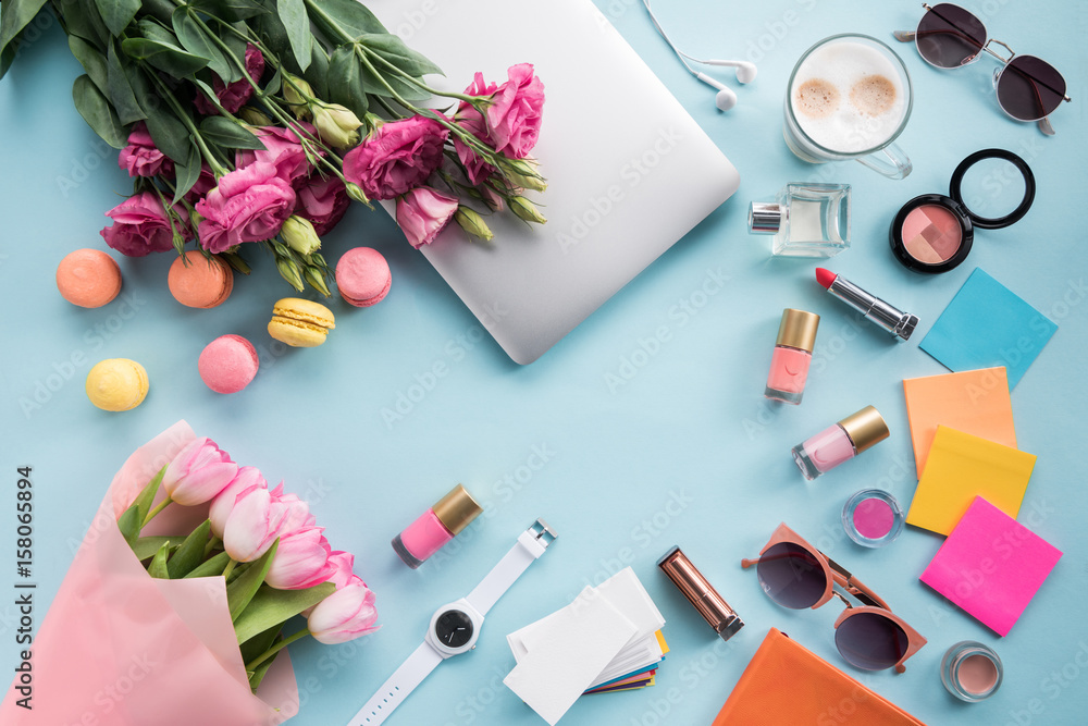 top view of bouquets of flowers with laptop and sunglasses with cosmetics mock-up top view of bouquets of flowers with laptop and sunglasses with cosmetics mock-up